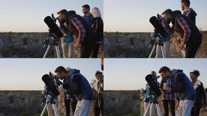 朋友使用专业望远镜一起凝视