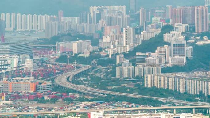 延时: 香港九龙的鸟瞰图，香港港口为背景