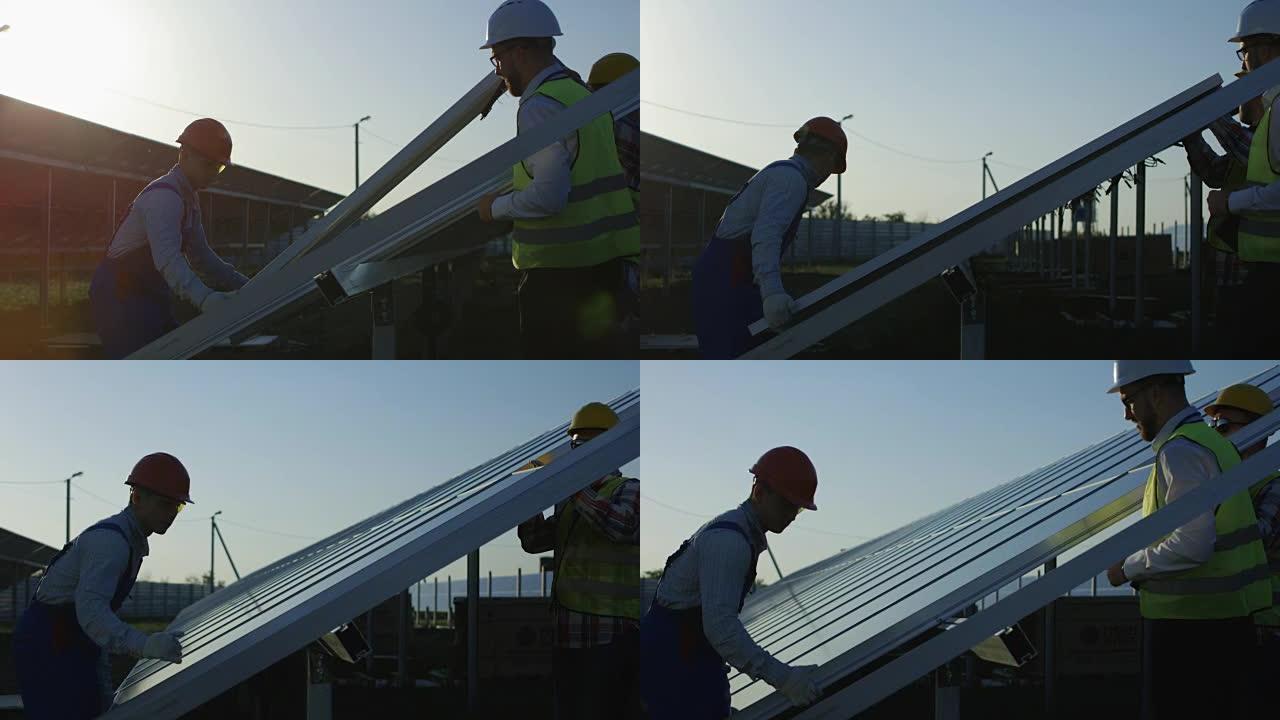 三名工人安装太阳能电池板