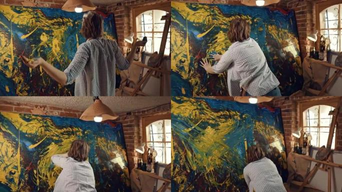 SLO MO才华横溢的女艺术家用手在画布上画画