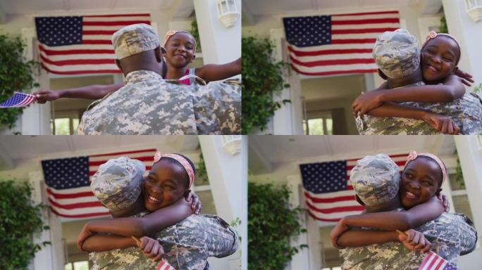 非裔美国士兵父亲在美国国旗前拥抱微笑的女儿