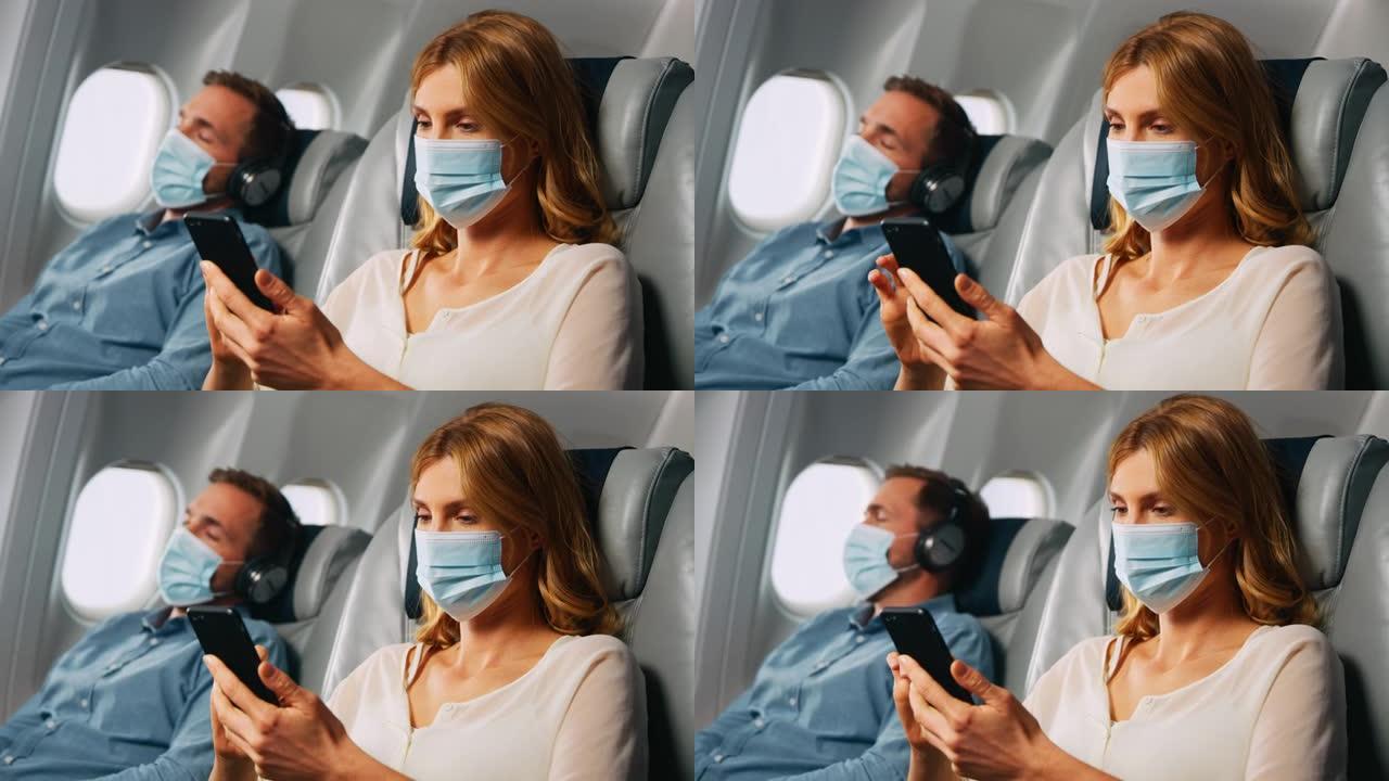 飞机上的智能手机情侣男女看手机