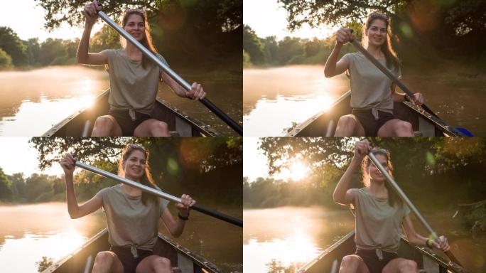 女人在河上划独木舟时玩得开心