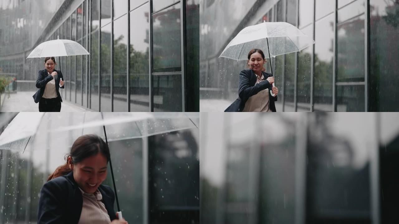 慢动作亚洲女商人在雨中带伞跑步