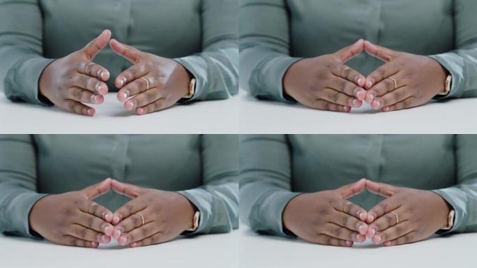 4k视频片段，一个无法识别的女人在现代办公室用手做手势