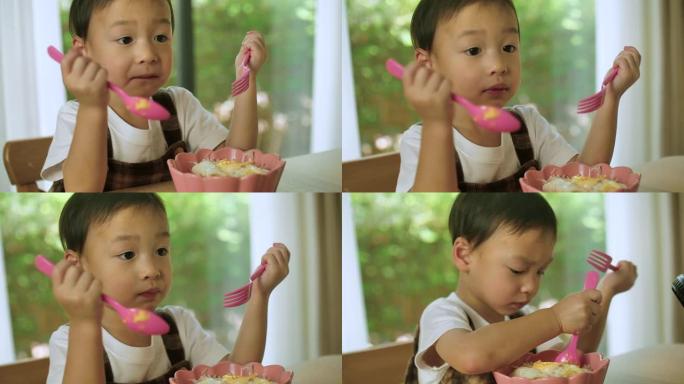 小男孩在家吃粥