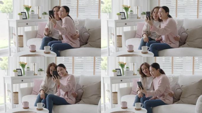 亚洲家庭老年老妇人平板手机视频通话屏幕