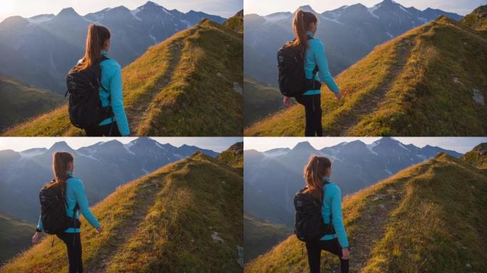 年轻女运动员徒步草山山脊环绕雄伟的山峰