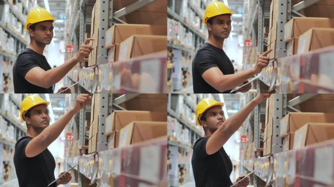 印度种族仓库工人戴着防护工作头盔在仓库工作，同时检查工业工厂仓库货架托盘上的产品。仓库概念。