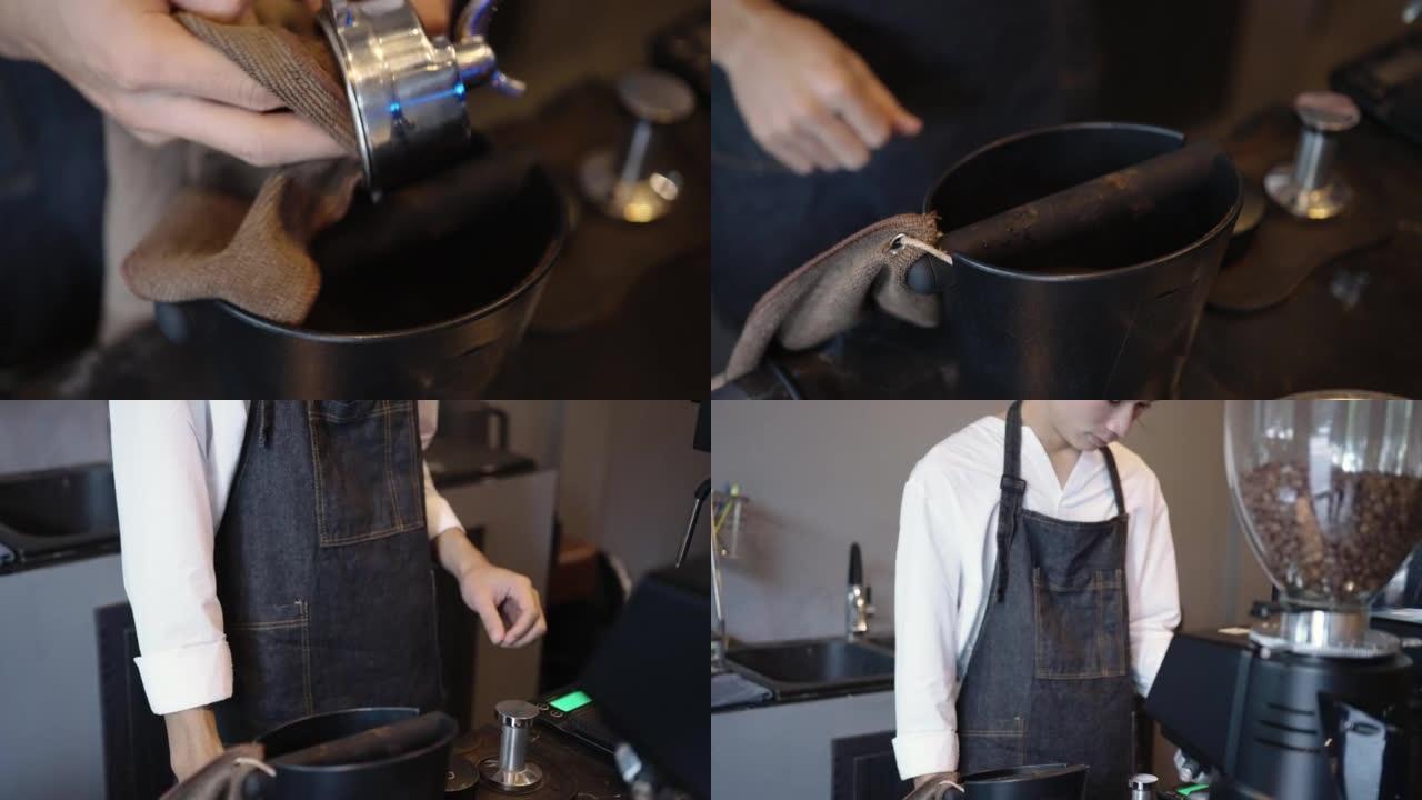 咖啡师的手在制作咖啡的过程中压实咖啡粉与机器在咖啡馆