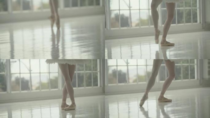 芭蕾舞演员的脚和脚穿着足尖鞋在舞蹈工作室跳舞美丽，优雅或古典舞蹈。芭蕾舞演员，专业艺术家或表演者练习