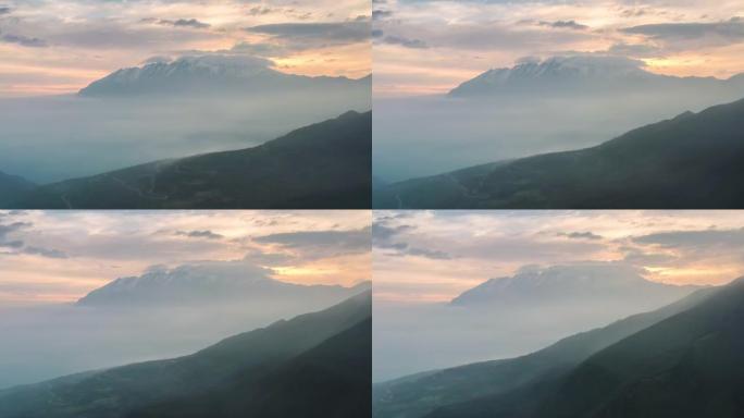 薄雾笼罩着天空，山峰看上去柔和而梦幻