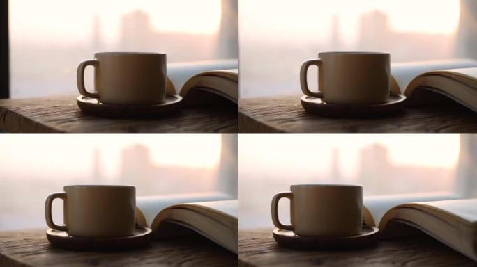 一杯咖啡和一本木桌上的书