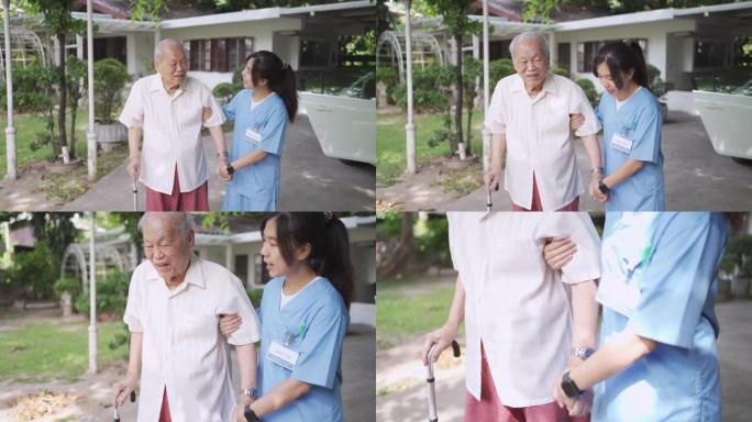 护士协助老年病人在前院散步