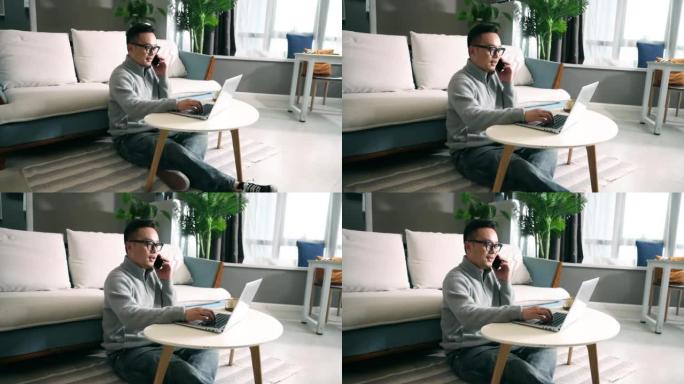 男人在家工作，用电话讨论生意