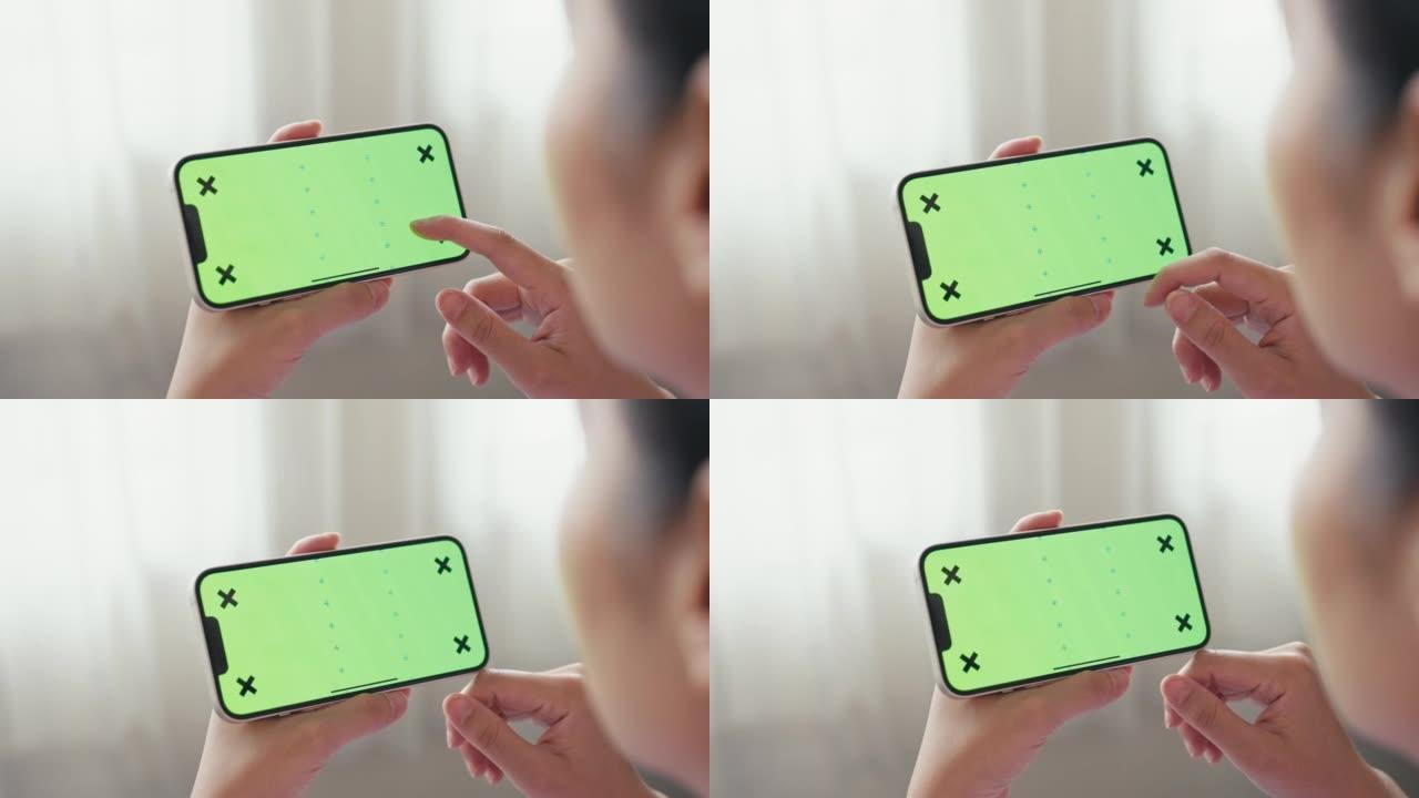 女人看绿屏智能手机