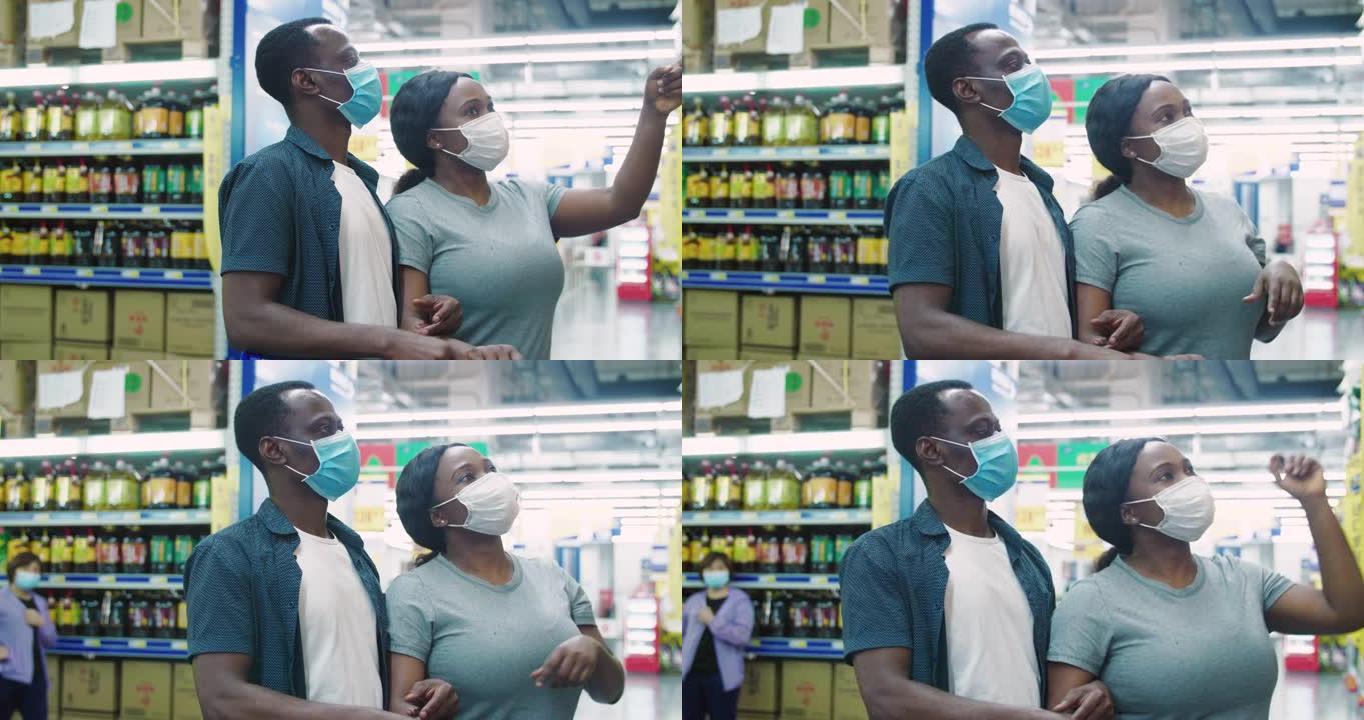 非洲夫妇带着口罩在超市购物