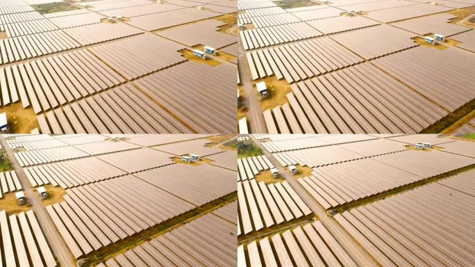 日落时沙漠中的鸟瞰图太阳能电池板