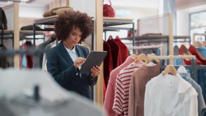 服装店: 女性商品经理使用平板电脑打造时尚系列。专业商店销售零售助理检查库存。小企业主订购商场物品。