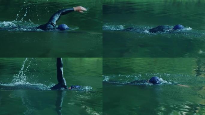 男子在湖中游泳自由泳野外一个男人