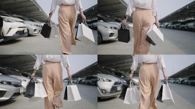 慢动作特写女人提着购物袋