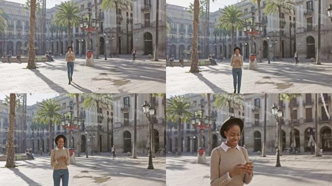 女人在户外手机发短信的实时视频在城市散步