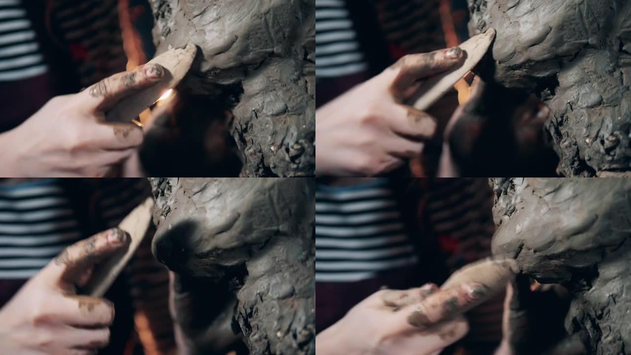 雕塑的粘土表面在特写镜头中变得光滑