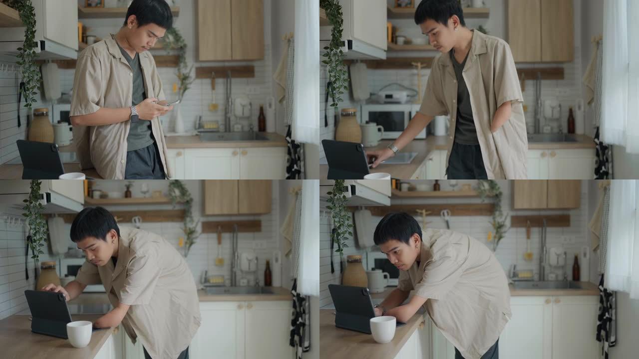 残疾人在厨房柜台上享用早晨咖啡时使用数字平板电脑和智能手机。
