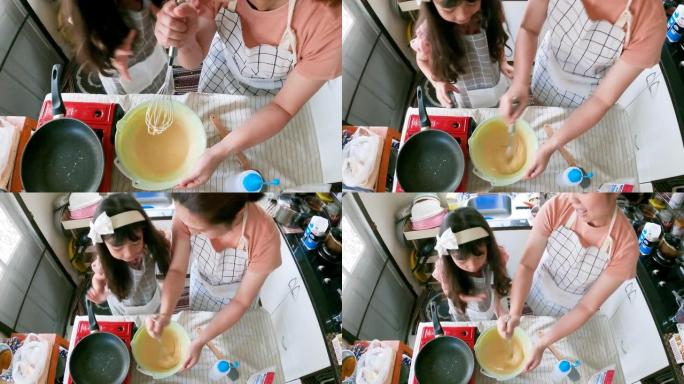 幸福母女在家厨房做锅饼