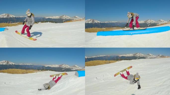 慢动作: 女孩滑雪者在滑轨时失去平衡后摔倒