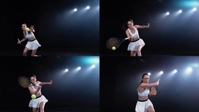 一名黑色背景的运动女网球运动员在聚光灯下击中一个低球的美学镜头。电影超级慢动作在冠军赛中捕捉到了胜利