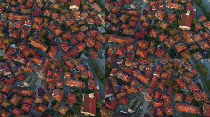 旧欧洲城市的屋顶。空中俯视图。狭窄蜿蜒的街道和旧房子的瓷砖屋顶。散步的好地方