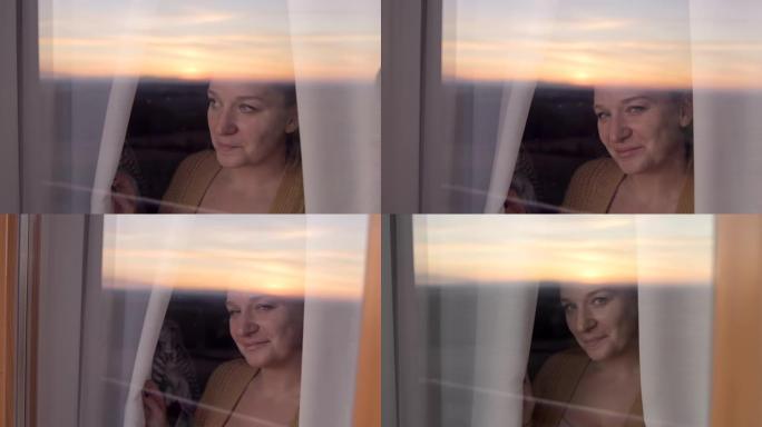 SLO MO肖像，一个幸福的女人站在她家的窗户前