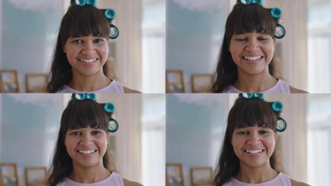 肖像有趣的少女戴着卷发器微笑快乐的少女在家青少年自我形象概念4k镜头