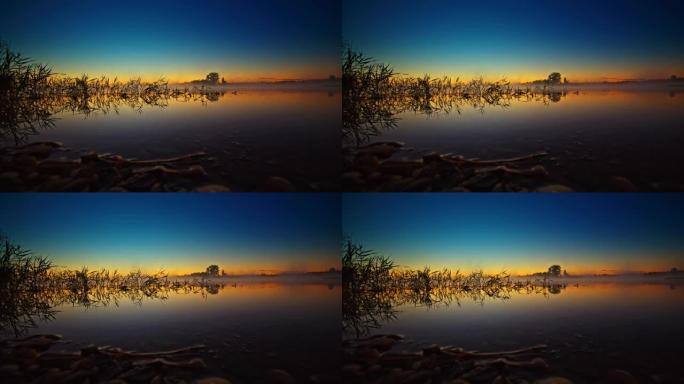 日出天空下的宁静湖