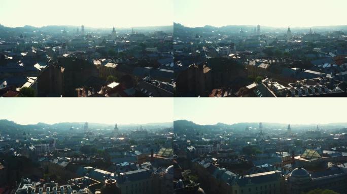 田园诗般的老城区利沃夫城市景观的电影空中背景，太阳升起在美丽的历史住宅建筑上