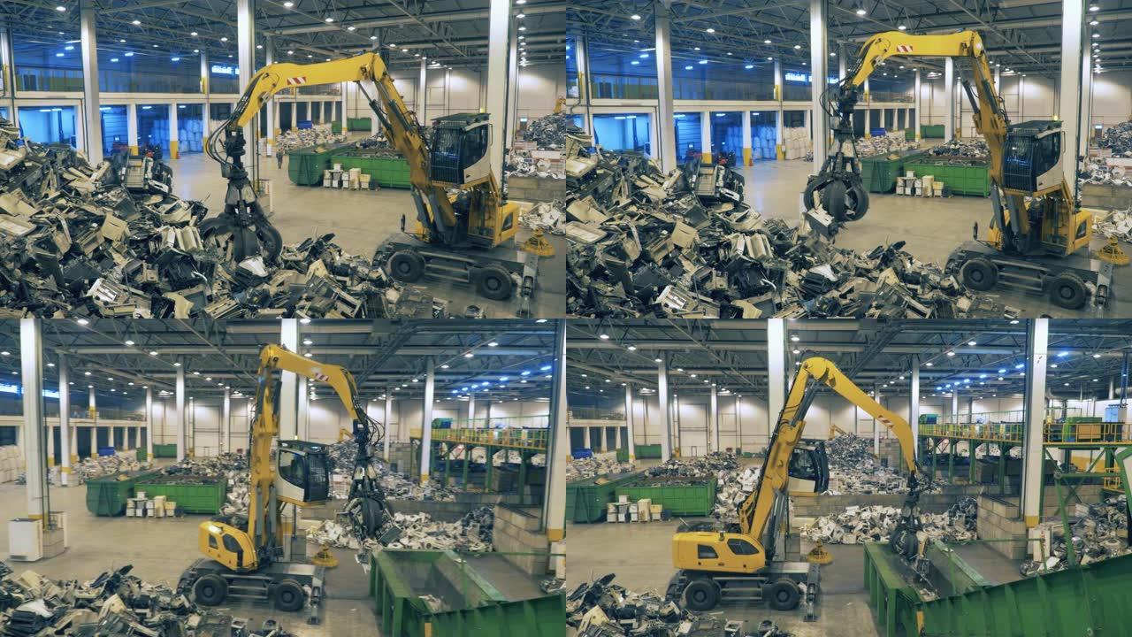 工作机器在回收中心对gargabe进行分类。垃圾、电子垃圾回收厂。