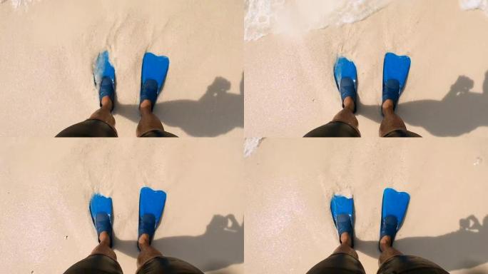 假期在海滩上浮潜的腿和鳍的特写