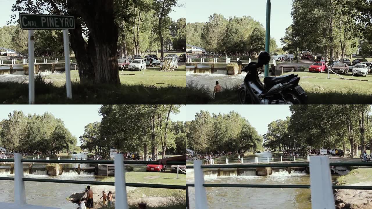 人们在阿根廷布宜诺斯艾利斯省享受一条小河。