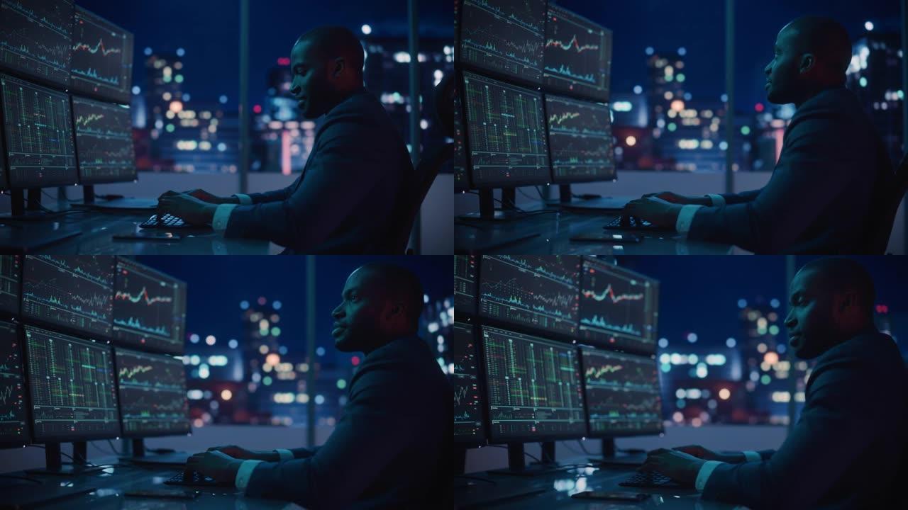 金融分析师在计算机上工作，具有实时股票，商品和交易所市场图表的多显示器工作站。非裔美国商人深夜在投资