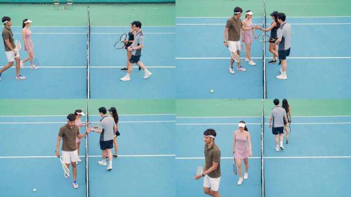团队球员在打网球后表现出他们的体育精神。