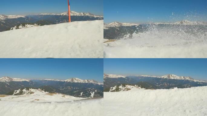 POV = 观点: 滑雪者在滑雪场的斜坡边缘喷洒积雪