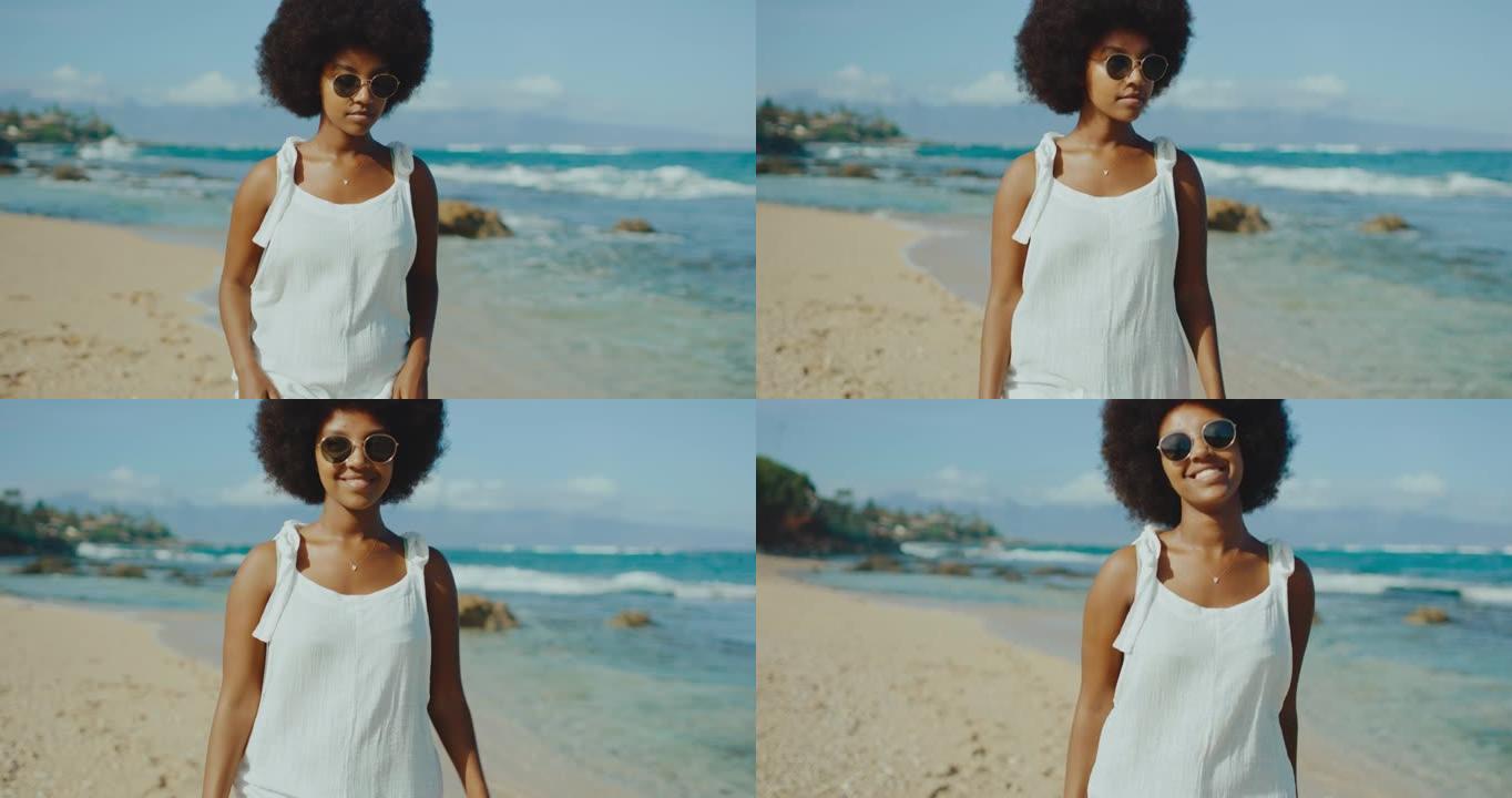 早晨非洲海滩氛围戴墨镜的女性走在沙滩上的