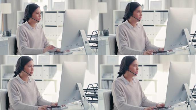 4k视频片段，一名年轻的女商人在呼叫中心的计算机上工作