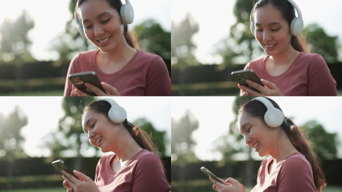 听音乐的亚洲女性看手机听音乐特写视频素材