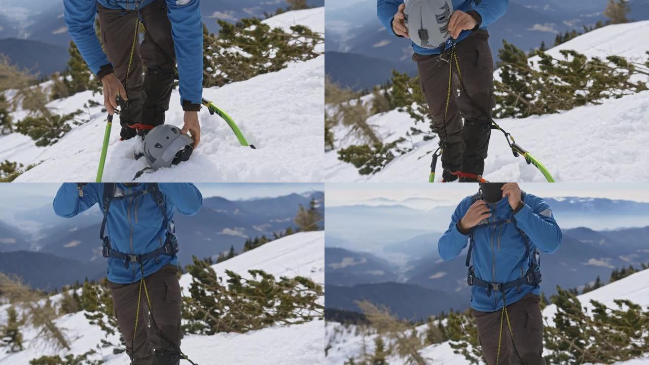 攀登雪山时戴着运动头盔的冰斧登山者