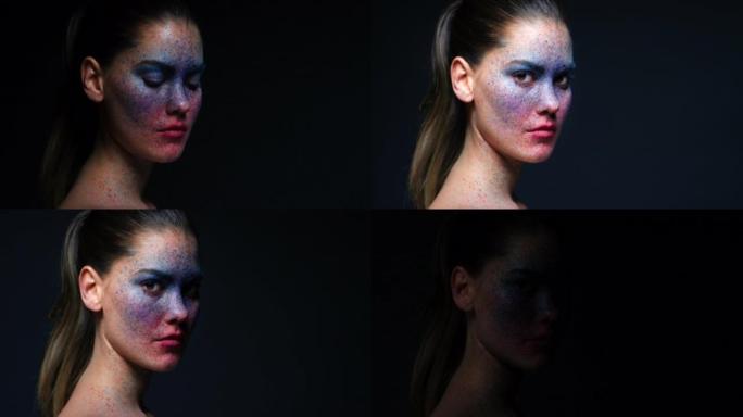 黑色工作室背景上的彩色面部彩绘化妆，女性肖像和独特的创意艺术和幻想化妆品。身体艺术家女孩，皮肤上有飞