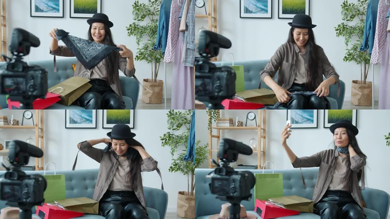 快乐的亚洲女士试穿时尚围巾，谈论互联网vlog的时尚录制视频