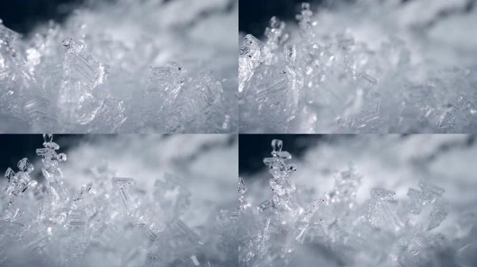 摄像机在雪晶中移动。透明雪冰层背景。真正的雪霜数字。冬季自然滑行镜头。高质量，UHD