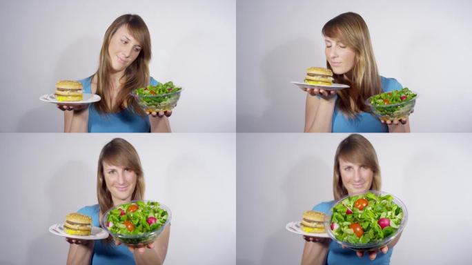 肖像: 女人在权衡午餐选择时选择沙拉而不是汉堡。
